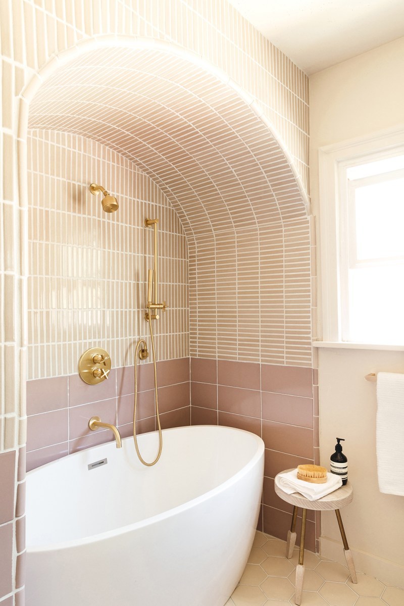 89 Pink Bathroom Ideas: From Hot Pink Walls to Blush Tiles 48 pink-bathroom-arched-ceiling-freestanding-bath-nordroom