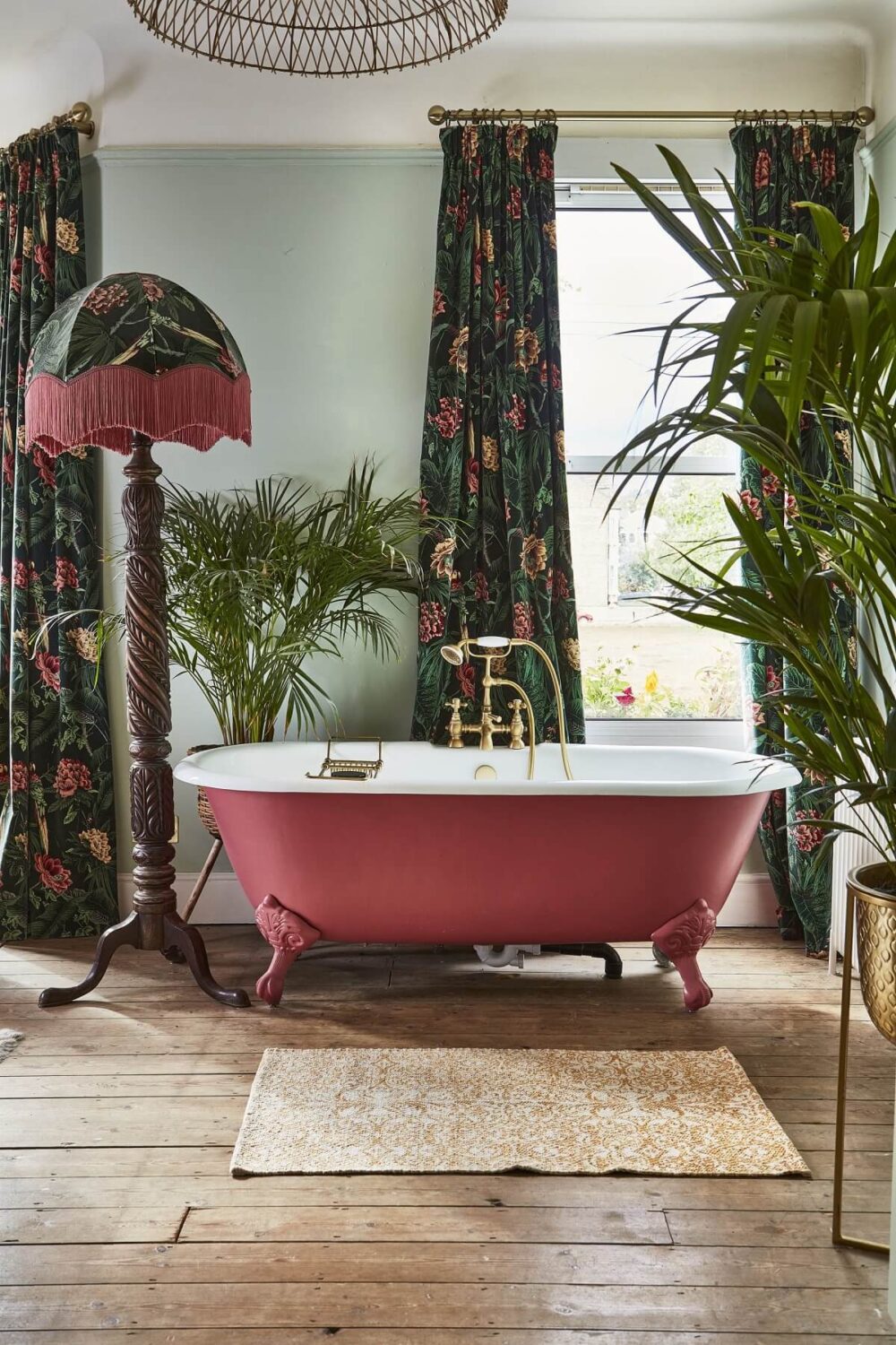 89 Pink Bathroom Ideas: From Hot Pink Walls to Blush Tiles 18 pink-clawfoot-bath-floral-curtains-70s-inspired-home-nordroom