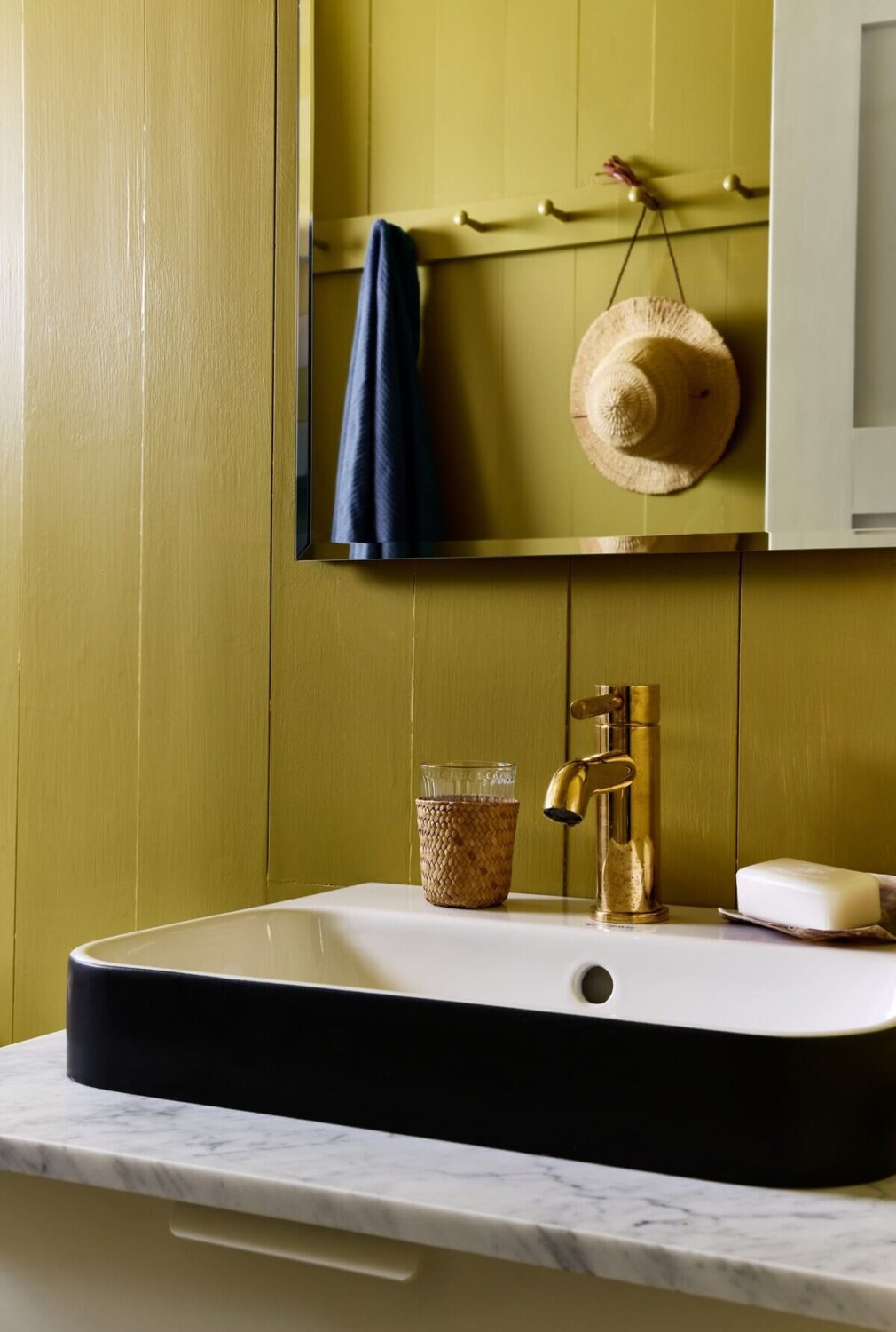 A Montauk Airbnb Designed by Robert McKinley 15 powder-room-wood-paneled-walls-nordrom