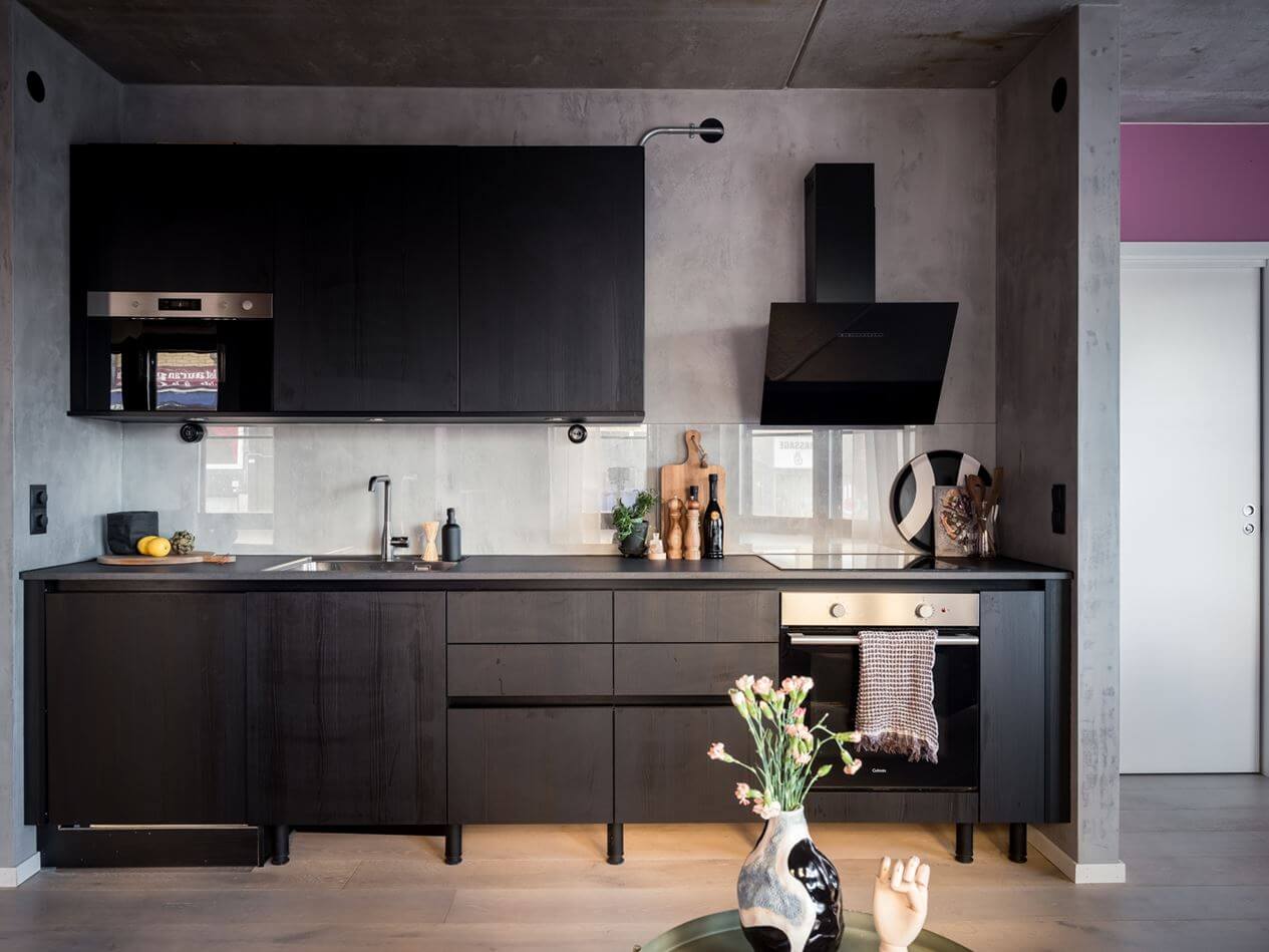 A Small Industrial Apartment with Pink Walls 4 black-scandinavian-kitchen-industrial-apartment-nordroom