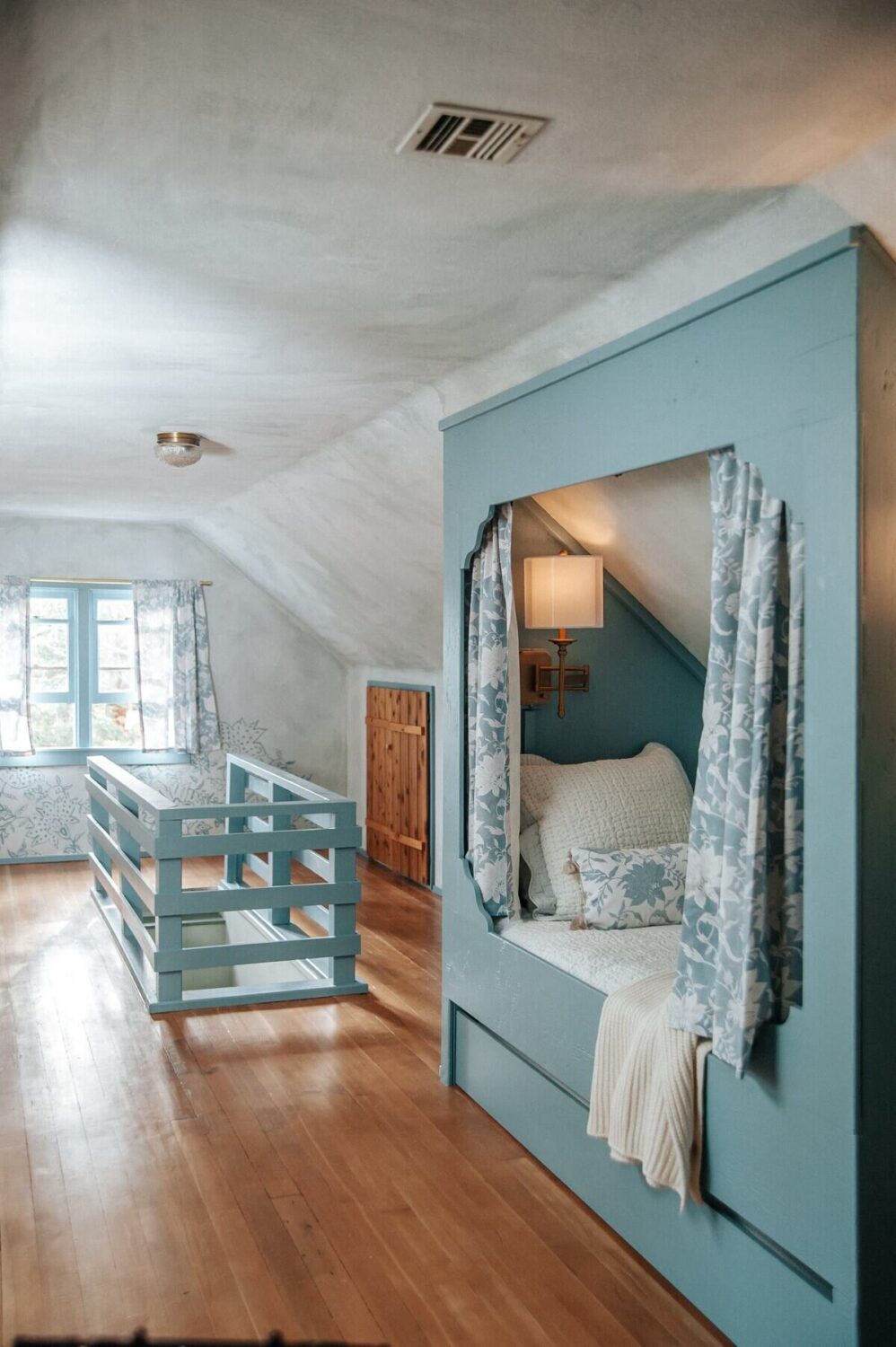 An Interior Designer's Colorful Airbnb Cabin 18 blue-attic-bedroom-bed-nook-nordroom