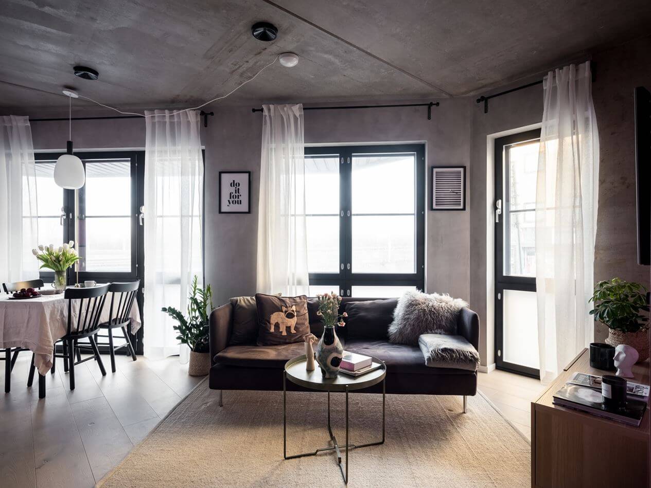 A Small Industrial Apartment with Pink Walls 2 industrial-living-room-concrete-walls-oak-floor-nordroom