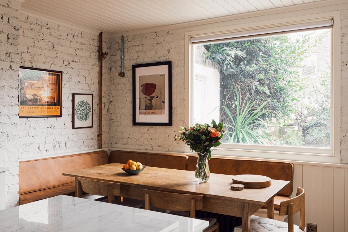 An Elegant & Colorful London House 7 kitchen-dining-area-built-in-bench-brick-walls-nordroom