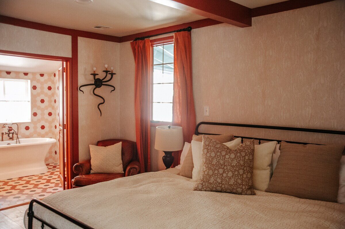 An Interior Designer's Colorful Airbnb Cabin 12 master-bedroom-en-suite-bathroom-nordroom