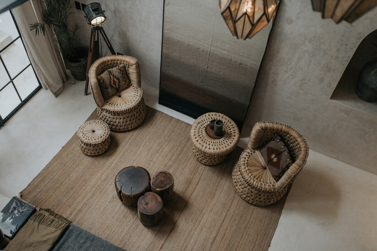 A Tulum Airbnb in an Architectural Building 7 natural-living-room-jute-rug-rattan-chairs-nordroom