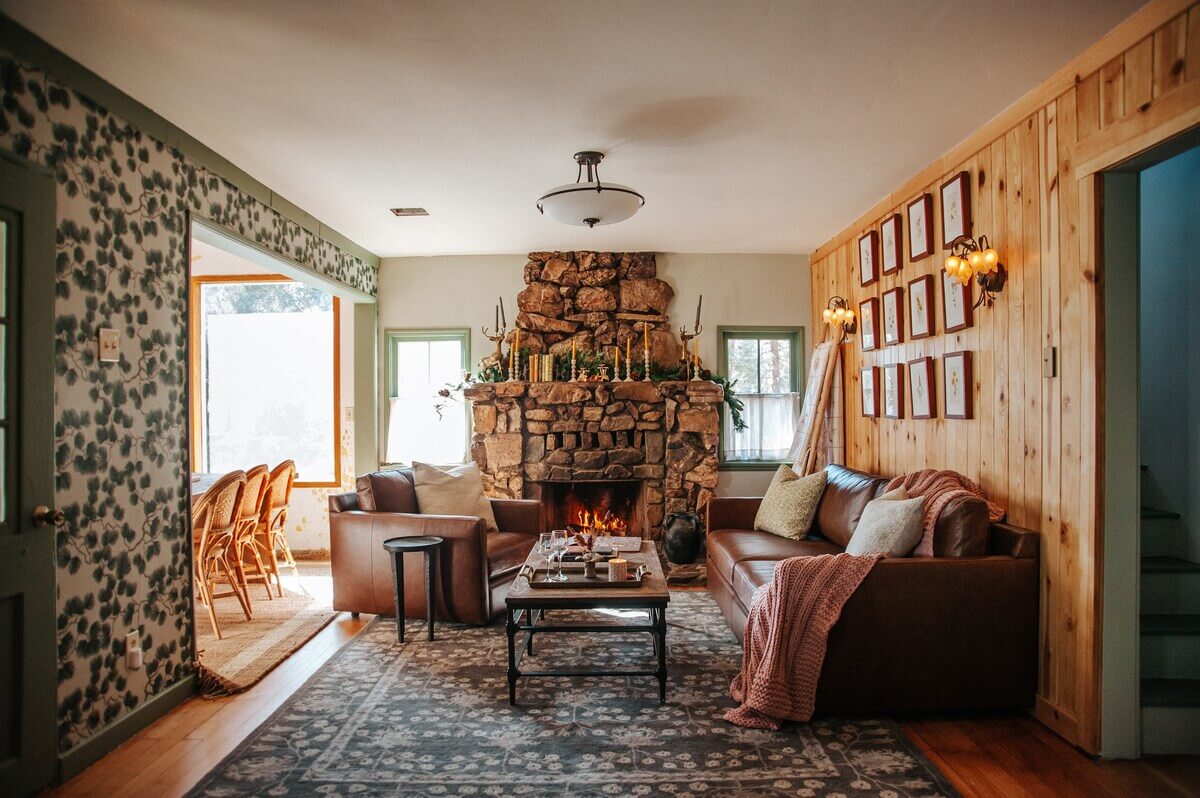 rustic-living-room-fireplace-wooden-walls-airbnb-cabin-nordroom