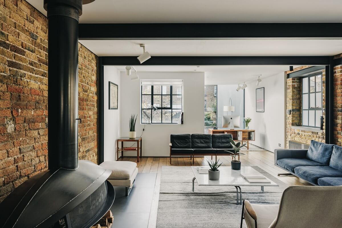 An Industrial Warehouse Conversion in London 4 sitting-room-exposed-brick-walls-fireplace-nordroom