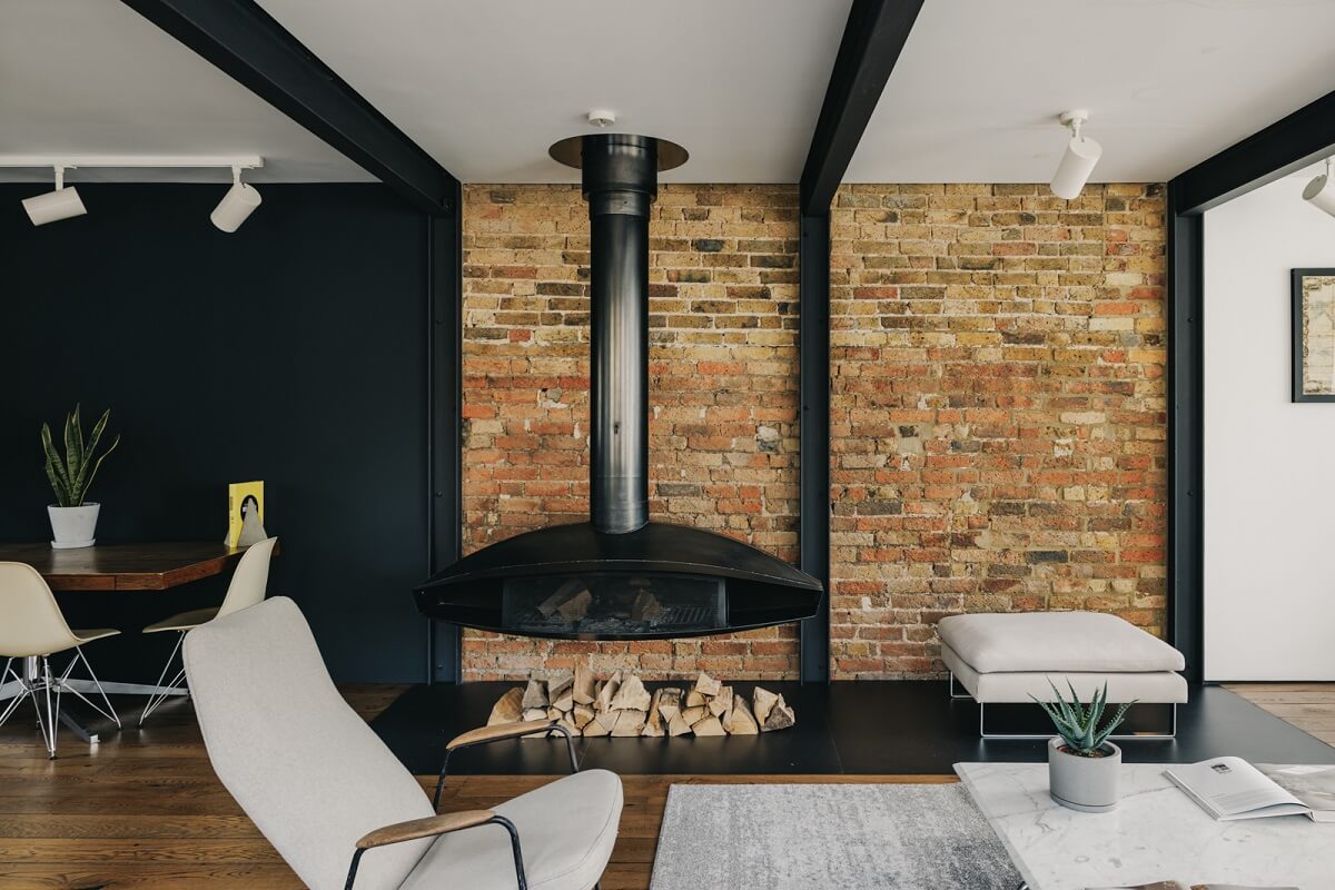 An Industrial Warehouse Conversion in London 3 sitting-room-fireplace-exposed-brick-nordroom