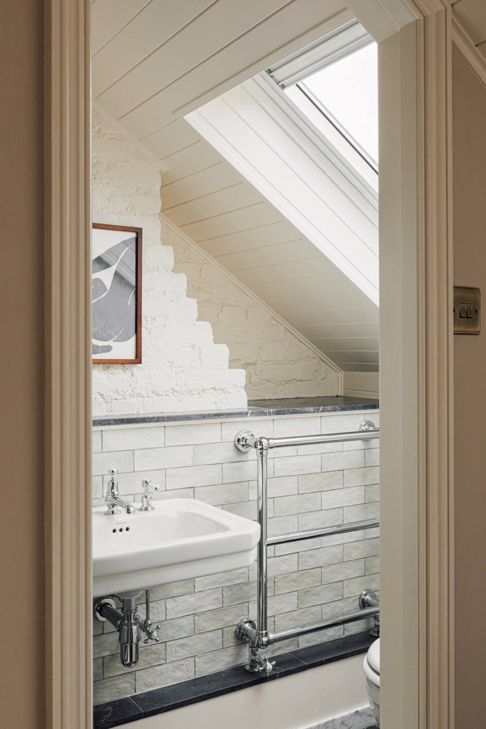 An Elegant & Colorful London House 24 small-ensuite-bathroom-white-tiles-skylight-nordroom