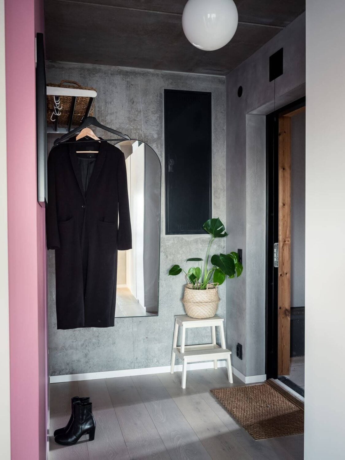 A Small Industrial Apartment with Pink Walls 12 small-hallway-concrete-walls-industrial-scandinavian-apartment-nordroom