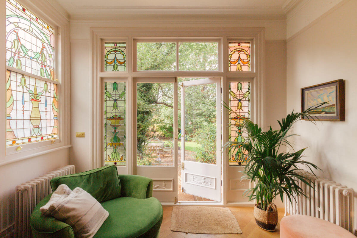 A Light-Filled Victorian Family Home in London 10 sun-room-green-velvet-chair-nordroom