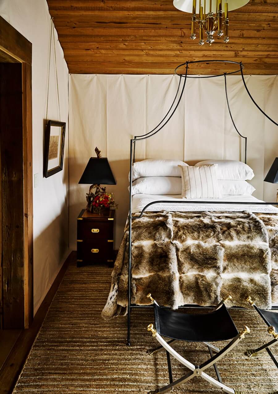 A Rustic Mountain Home in Big Sky, Montana 8 warm-neutral-bedroom-wooden-ceiling-canopy-bed-nordroom