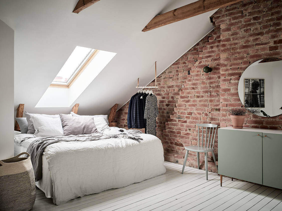How To Decorate A Bedroom with A Slanted Ceiling 21 bedroom-slanted-ceiling-hanging-wardrobe-bed-under-eaves-exposed-brick-nordroom