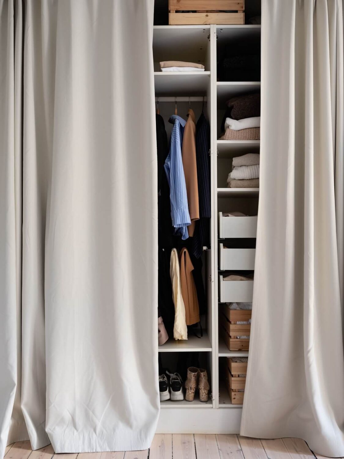 A Warm Soft Colored Home in Stockholm 16 bedroom-wardrobe-curtain-nordroom