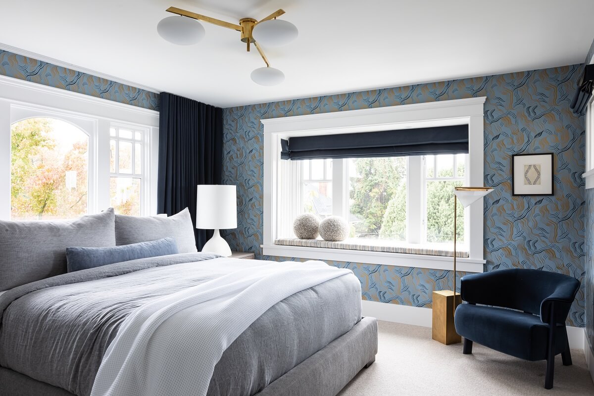 An Eclectic Elegant Home in Vancouver 25 blue-bedroom-wallpaper-velvet-blue-armchair-nordroom