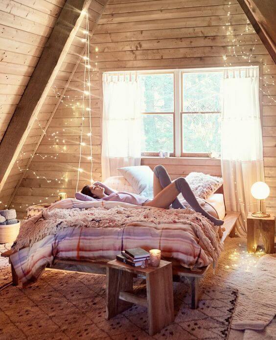 How To Decorate A Bedroom with A Slanted Ceiling 30 bohemian attic bedroom string lights nordroom How To Decorate A Bedroom with A Slanted Ceiling