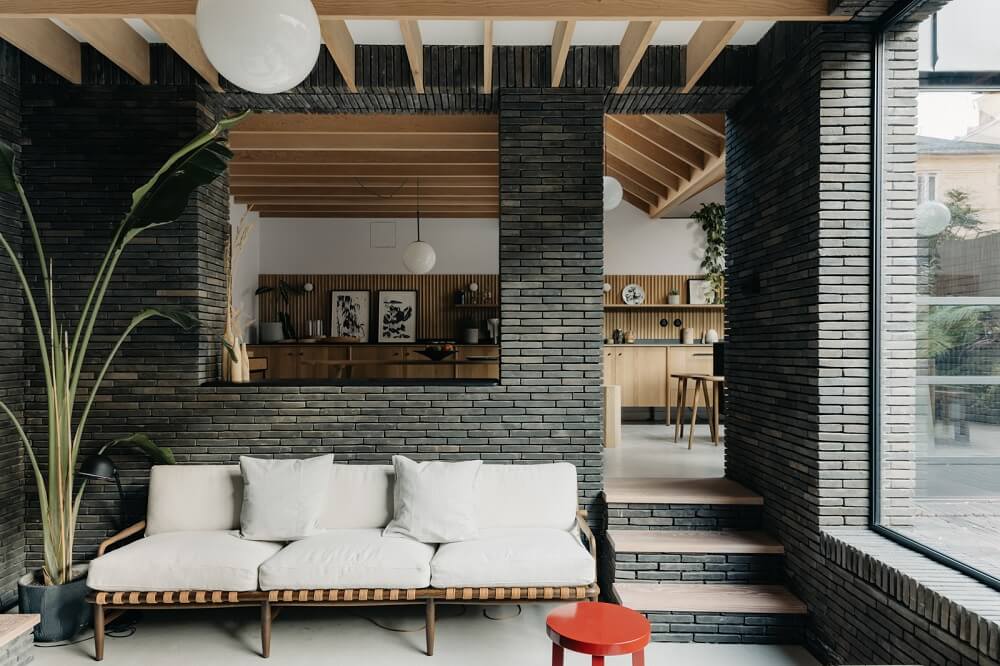 A Brick House in London Designed by Daniel Sanderson 4 brick-walls-living-room-kitchen-london-home-nordroom