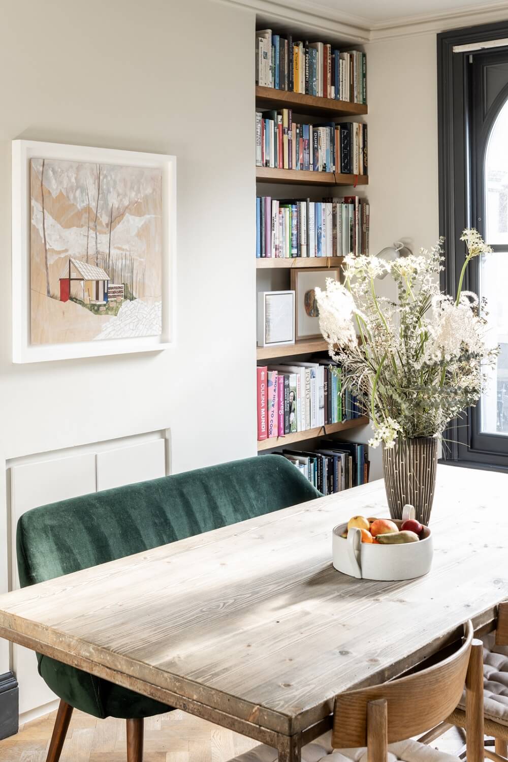 A London Family Home with Grey Accents 5 dining-table-velvet-bench-bookshelves-nordroom