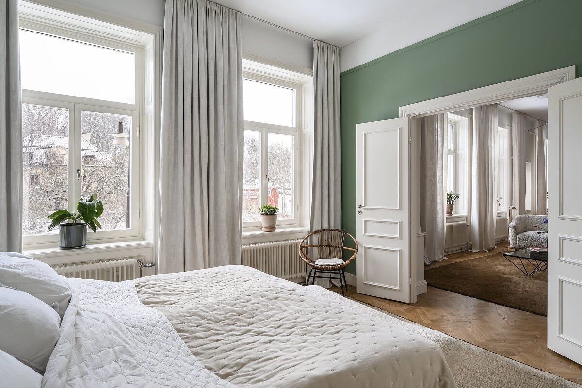 A Stylish Scandi Home with Oak Kitchen 14 green-bedroom-double-doors-scandinavian-home-nordroom