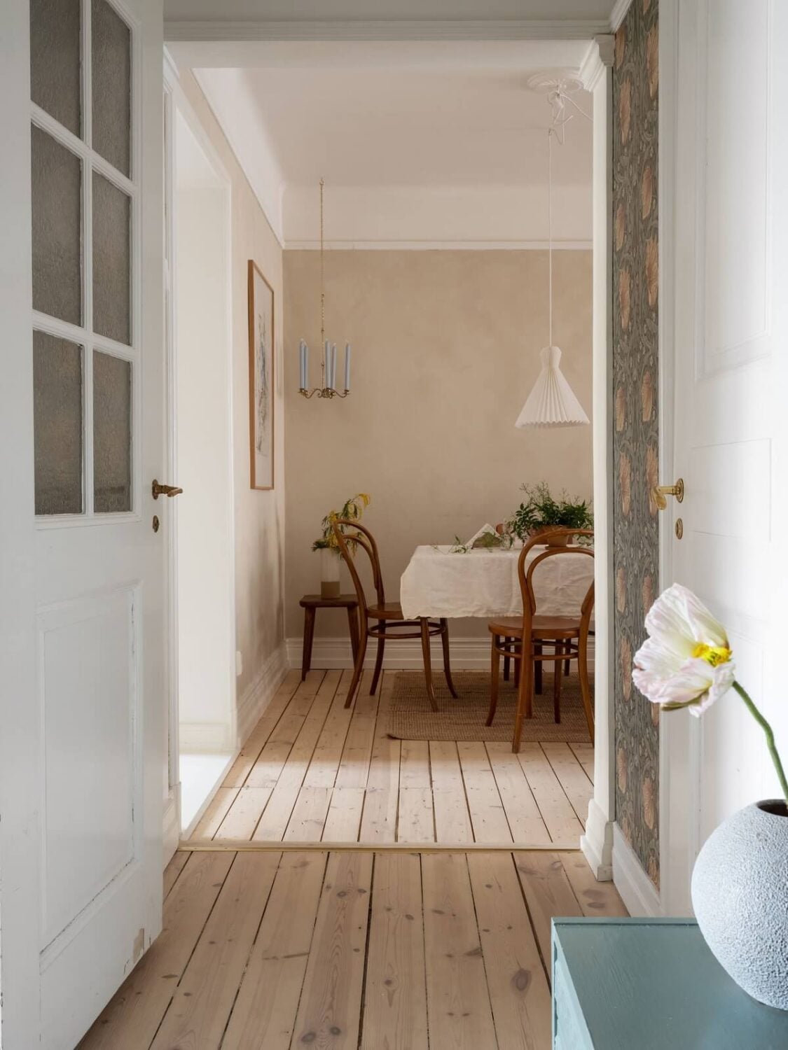 A Warm Soft Colored Home in Stockholm 8 hallway-living-room-wooden-floor-nordroom