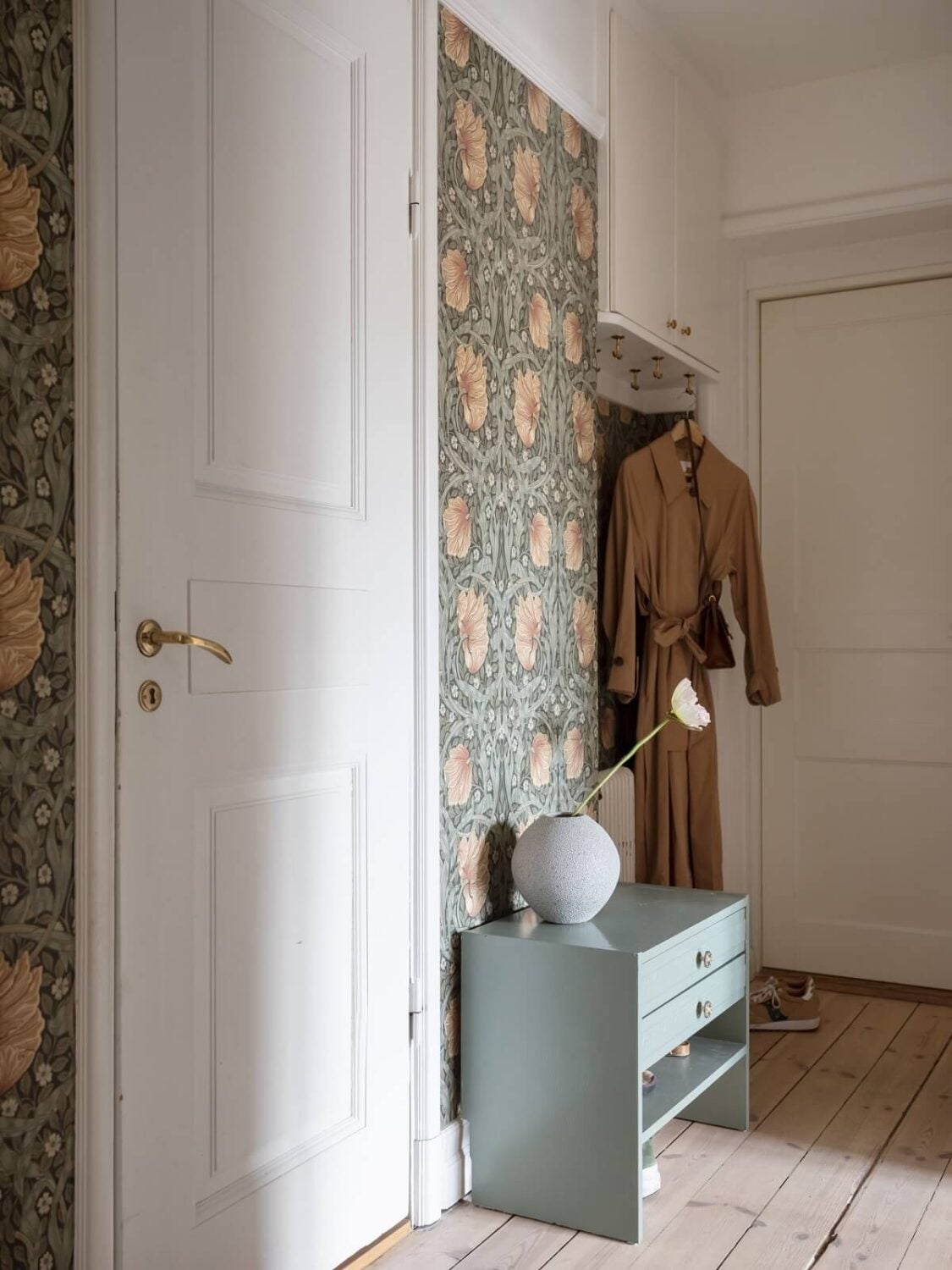 A Warm Soft Colored Home in Stockholm 17 hallway-william-morris-wallpaper-wooden-floor-nordroom