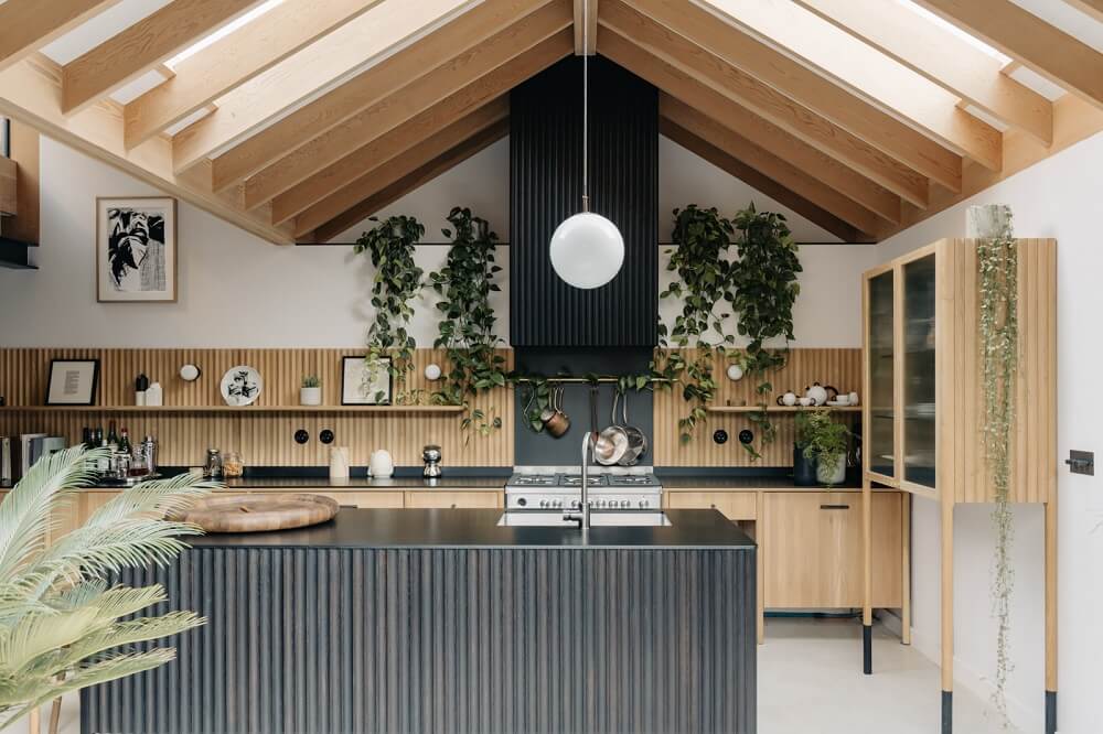 A Brick House in London Designed by Daniel Sanderson 10 kitchen-sloped-ceilings-black-kitchen-island-london-house-nordroom