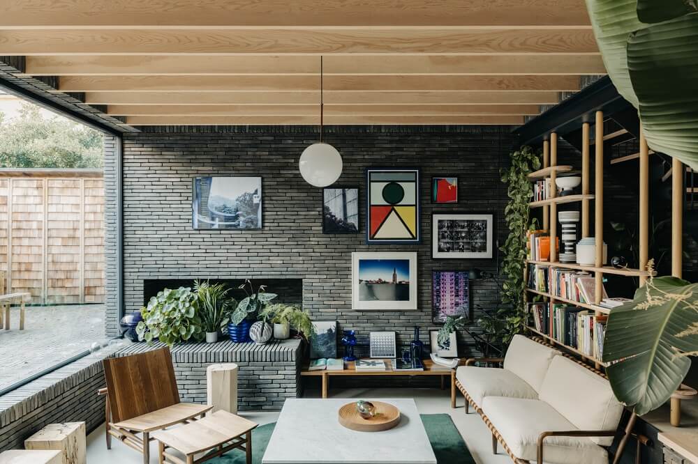 A Brick House in London Designed by Daniel Sanderson 1 living-room-black-brick-wooden-beams-bookshelves-nordroom