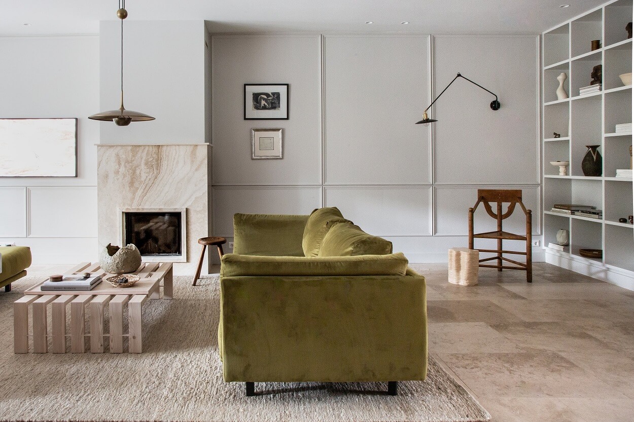 An Elegant Townhouse by Avenue Design Studio 11 living-room-green-velvet-sofa-limestone-floor-bookshelves-nordroom