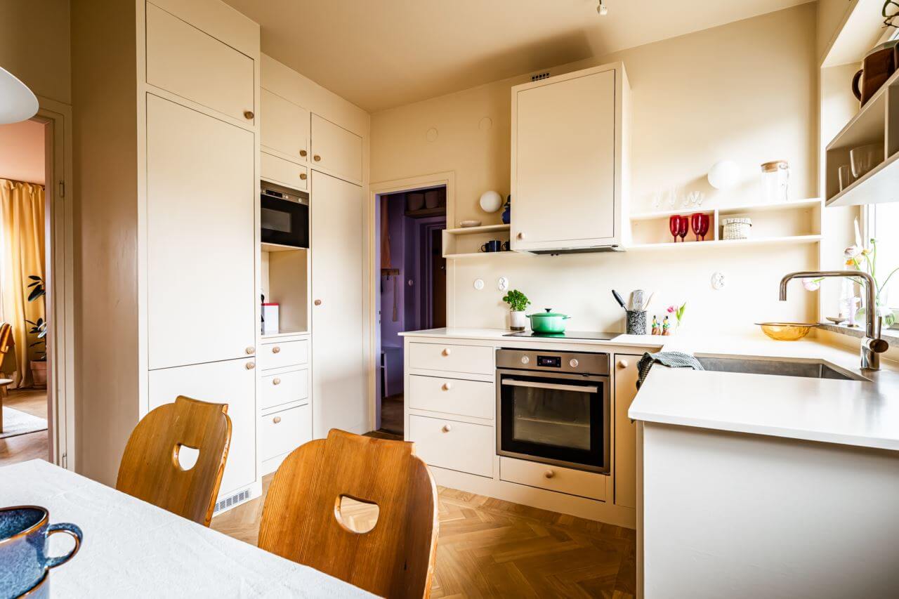 A Pink and Yellow Scandinavian Apartment 7 pale-yellow-kitchen-cabinets-colorful-scandinavian-home-nordroom