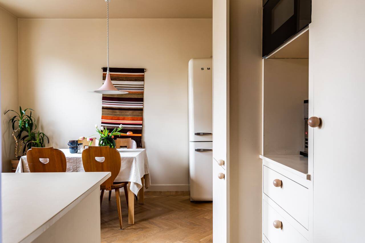A Pink and Yellow Scandinavian Apartment 11 pale-yellow-kitchen-dining-table-colorful-home-nordroom
