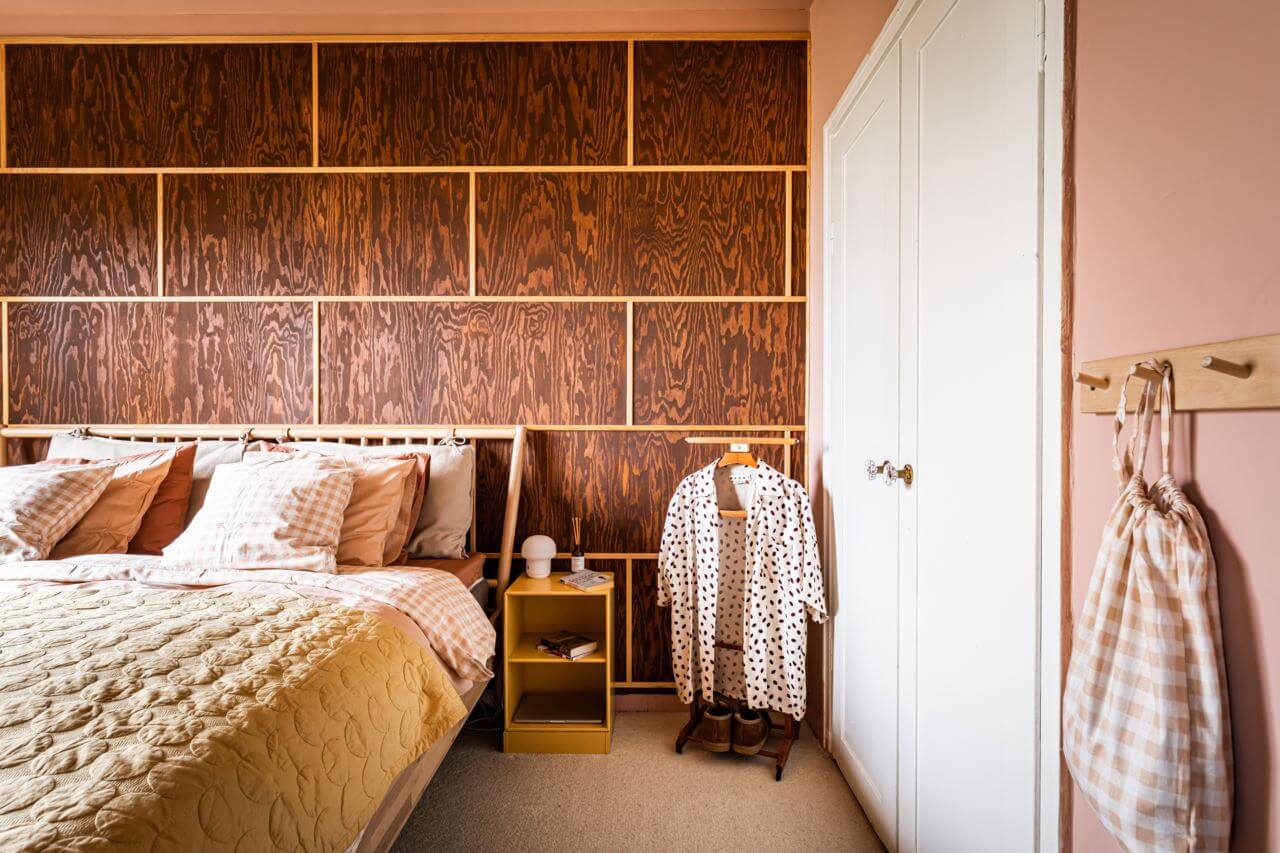 A Pink and Yellow Scandinavian Apartment 14 pink-bedroom-wood-walls-nordroom