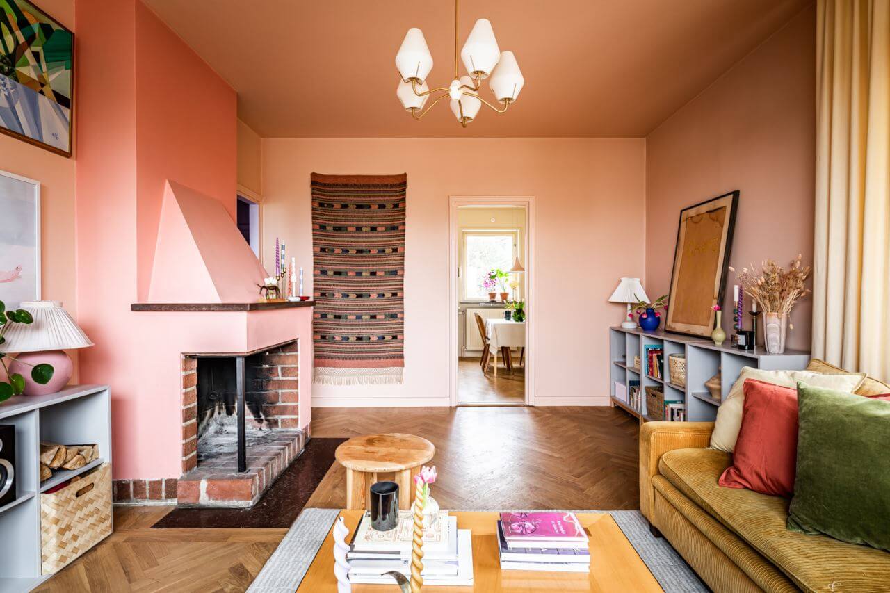 Pantone Color of the Year 2024 Home Decor Inspiration 40 pink-living-room-ochre-sofa-fireplace-nordroom