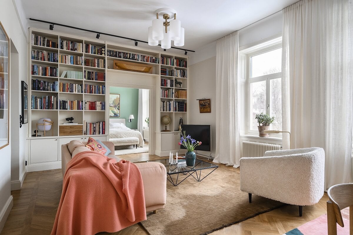A Stylish Scandi Home with Oak Kitchen 3 scandinavian-sitting-room-bookshelves-pink-sofa-nordroom