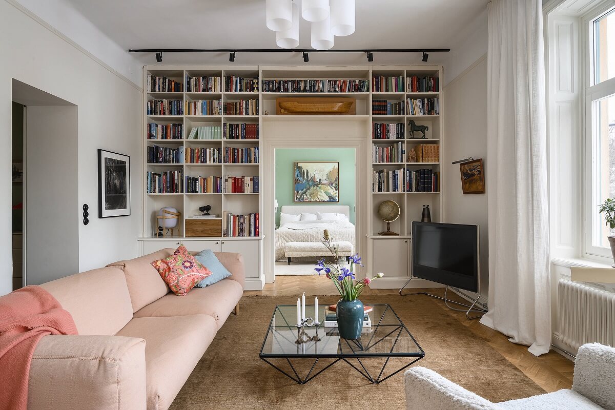 A Stylish Scandi Home with Oak Kitchen 5 sitting-room-built-in-bookshelves-pink-sofa-nordroom