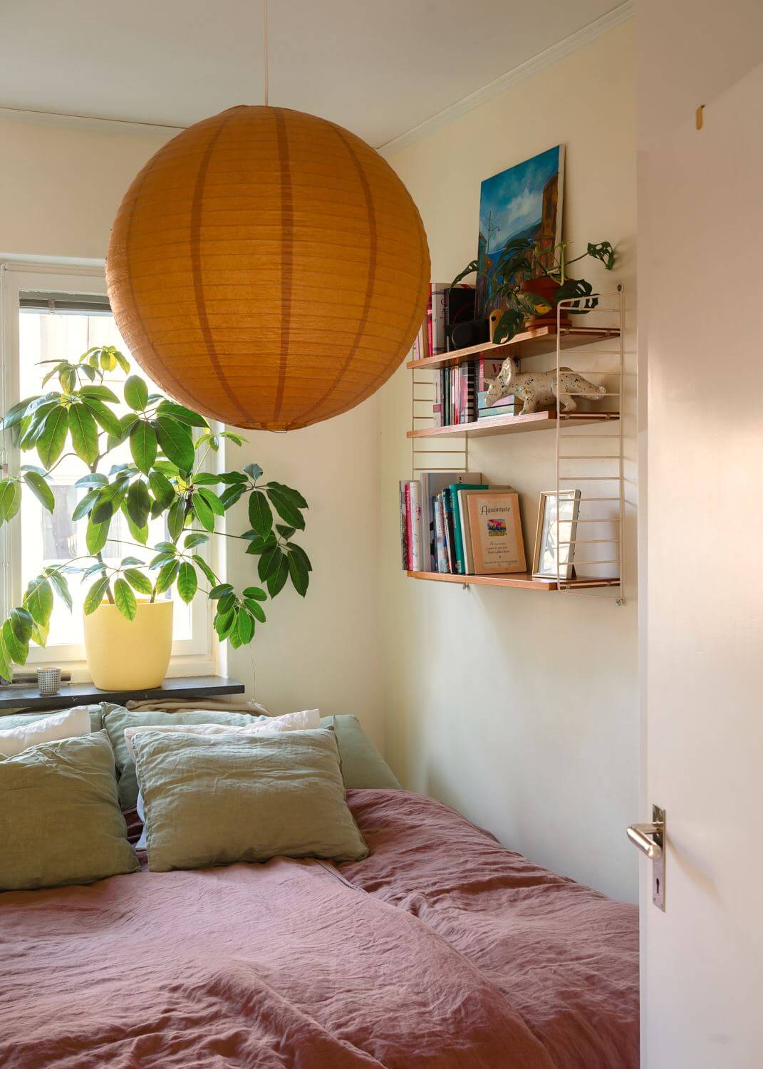 A Small Light Apartment with Plants 9 small-bedroom-string-shelves-yellow-walls-nordroom