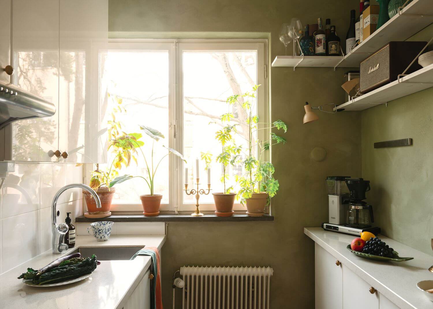 A Small Light Apartment with Plants 10 small-green-kitchen-white-cabinets-nordroom