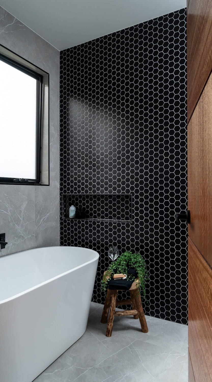 50 Amazing Black Bathroom Design Ideas 17 bathroom-black-hexagon-tiles-white-freestanding-bath-nordroom