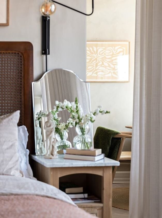 A Lovely Natural Apartment in Sweden 12 bedroom-detail-cane-headboard-nordroom