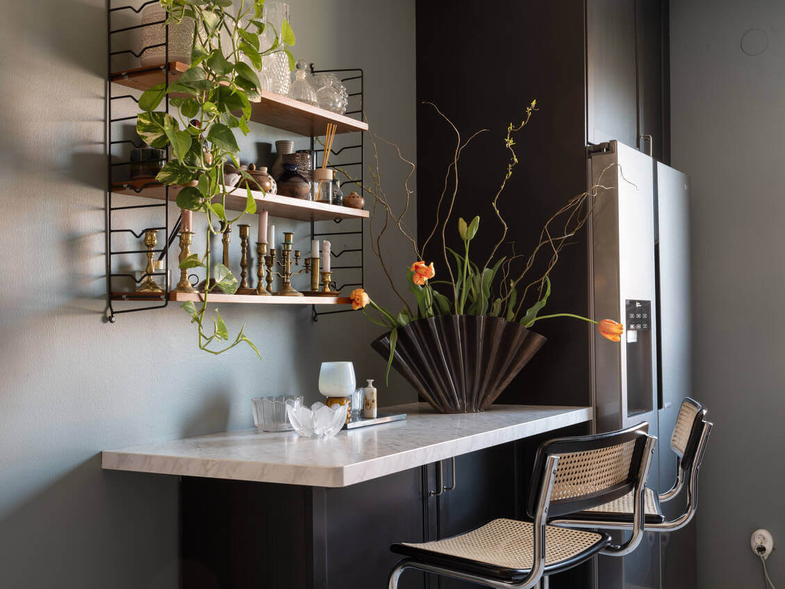 A Warm Neutral Colored Nordic Home 16 black-kitchen-bar-table-string-shelves-nordroom