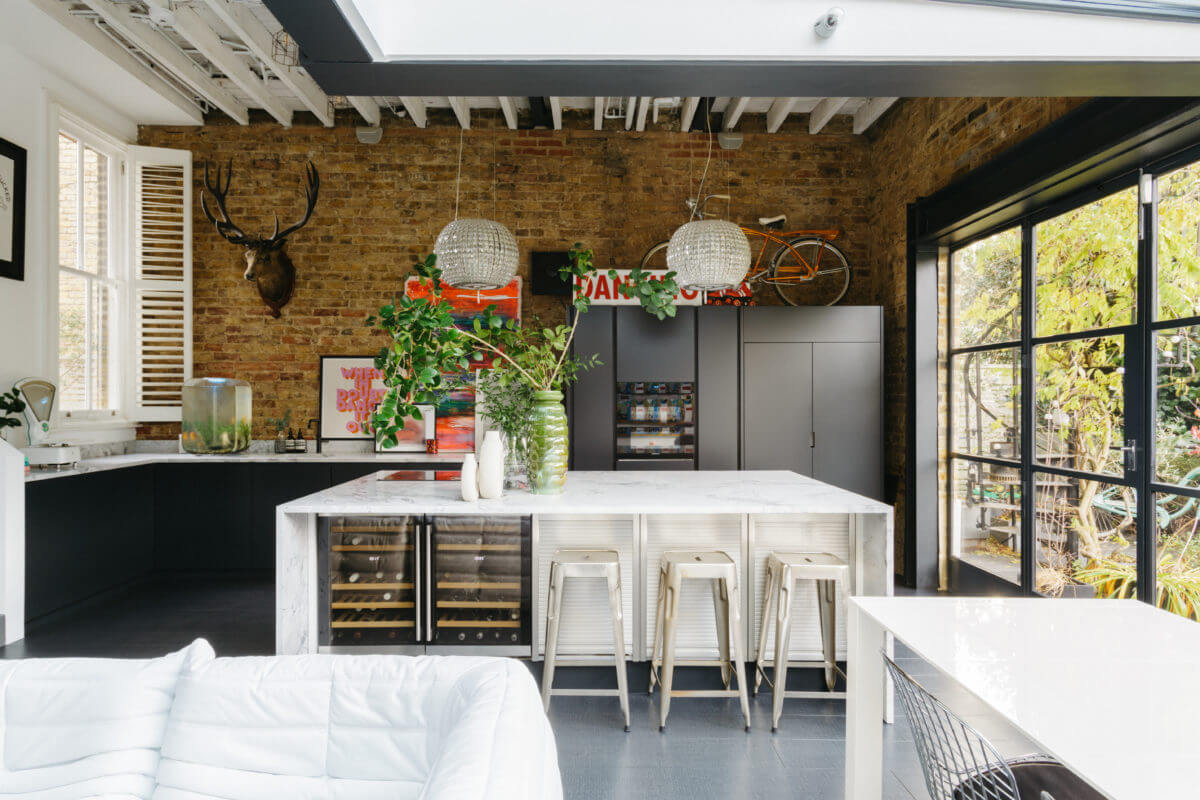 A Black and White Victorian House in London 8 black-white-kitchen-island-exposed-brick-wall-nordroom