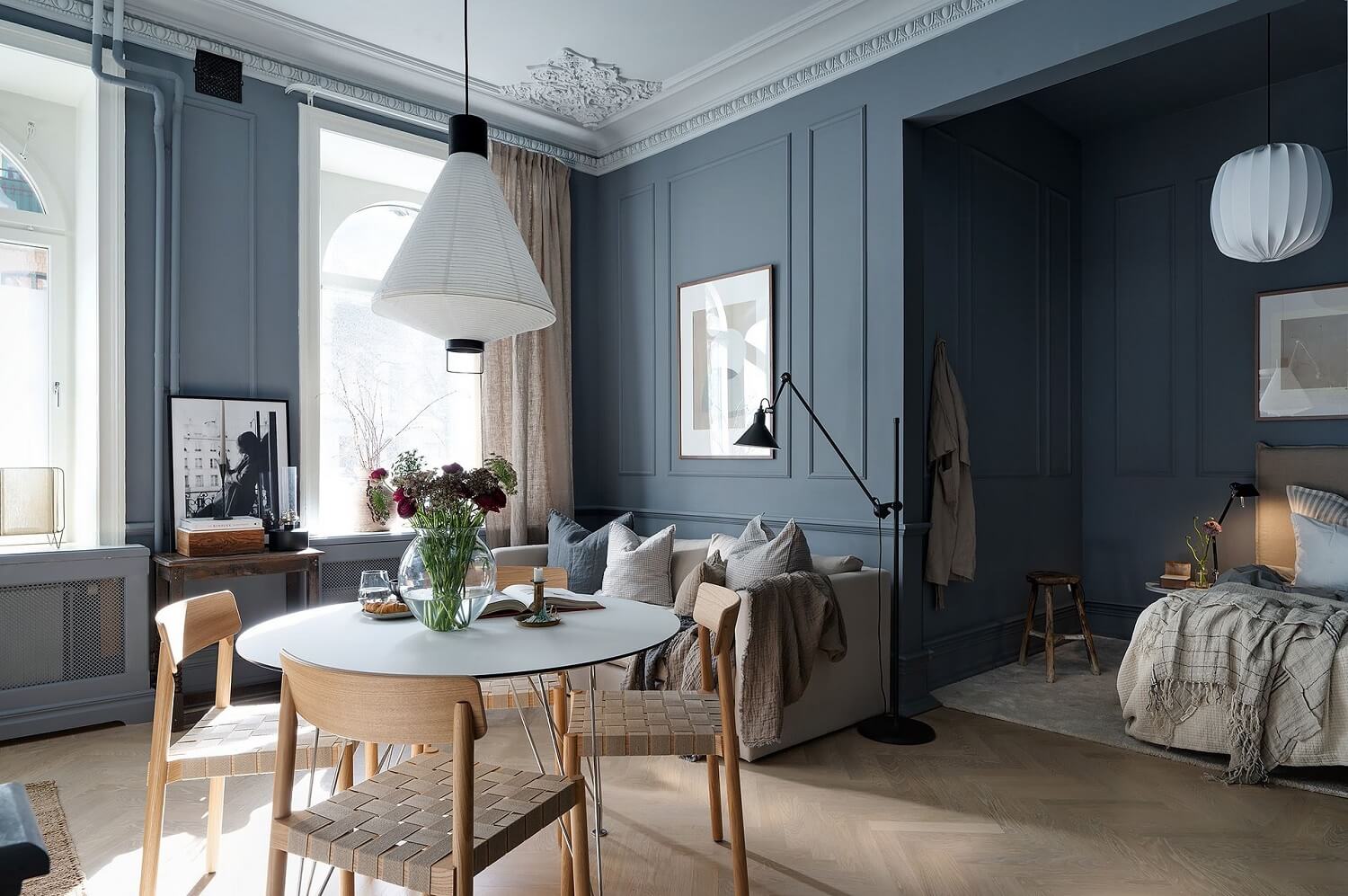 Great Living Room Bedroom Combo Ideas (Layout Tips + Styling) 21 blue-studio-apartment-round-dining-table-bed-alcove-nordroom