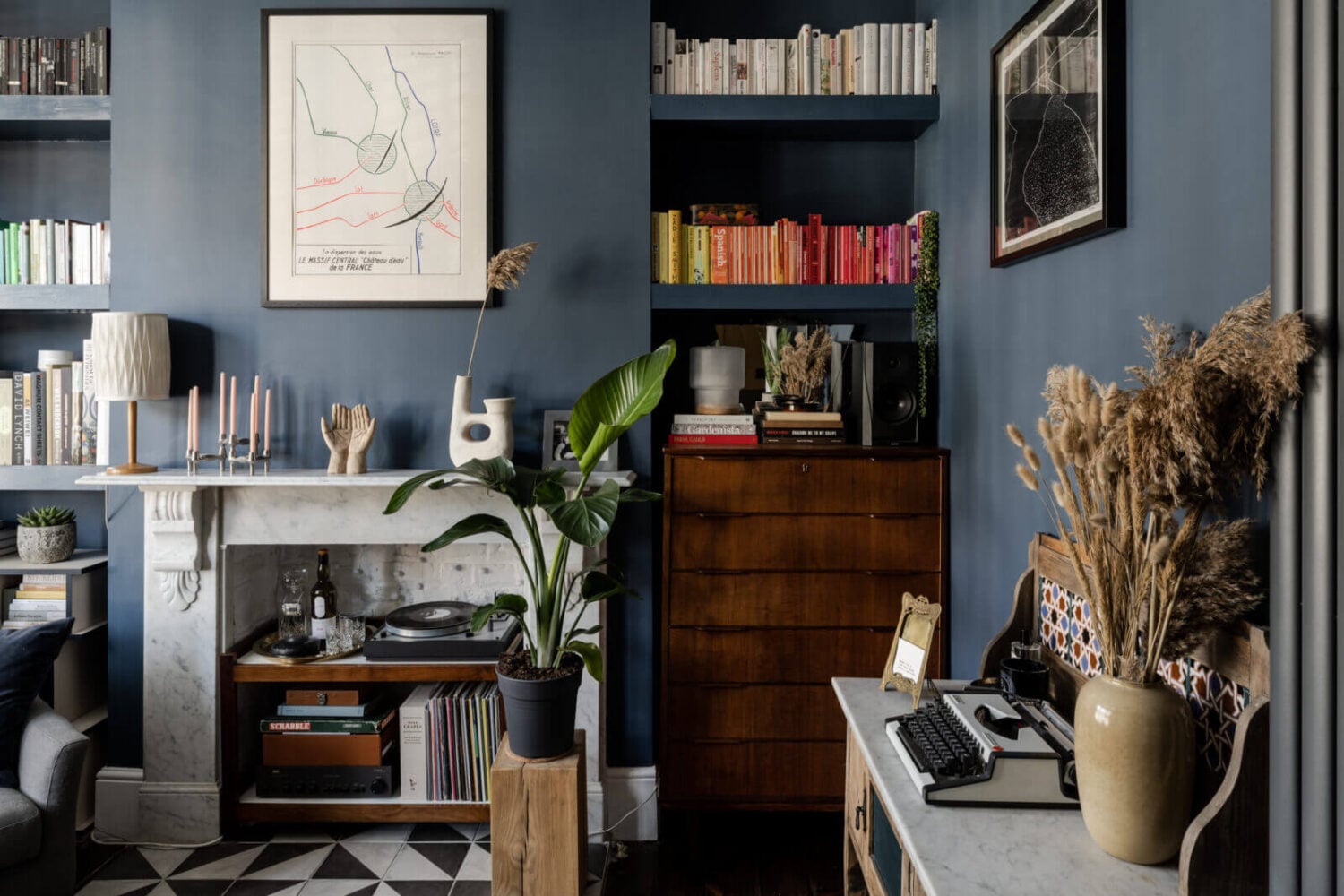 A Cozy Flat in London with Navy Blue Living Room 4 built-in-bookshelves-fireplace-dark-blue-living-room-nordroom