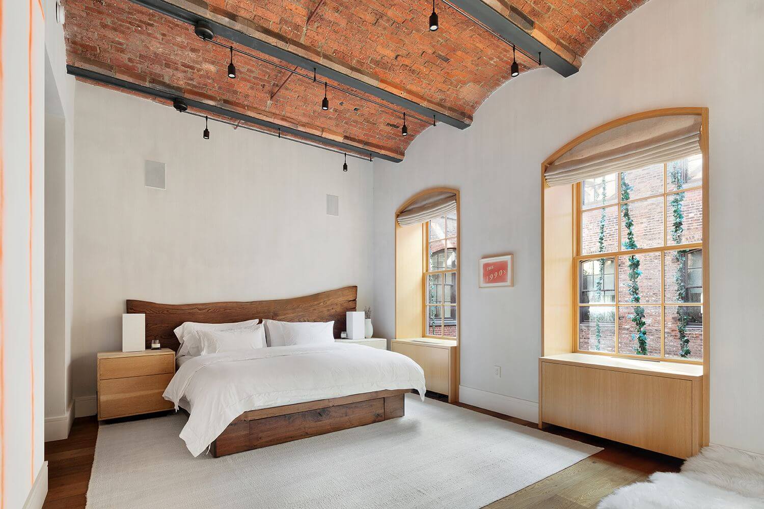 Jonah Hill Sells His Modern Manhattan Loft 7 contemporary-bedroom-wood-headboard-vaulted-ceiling-manhattan-loft-nordroom
