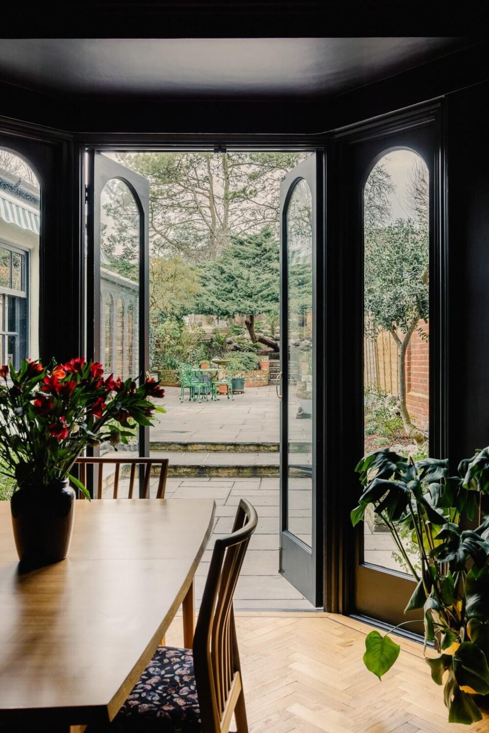 A Green Kitchen with Pink Ceiling in a Colorful London Home 9 dark-blue-dining-room-bay-window-garden-nordroom