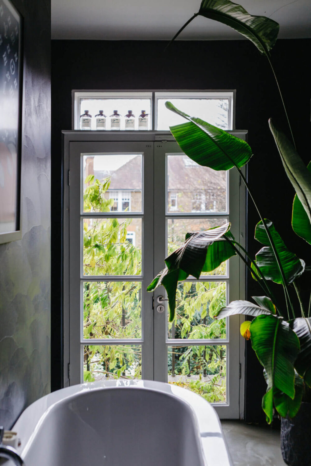 A Black and White Victorian House in London 30 freestanding-bath-garden-view-black-bathroom-nordroom