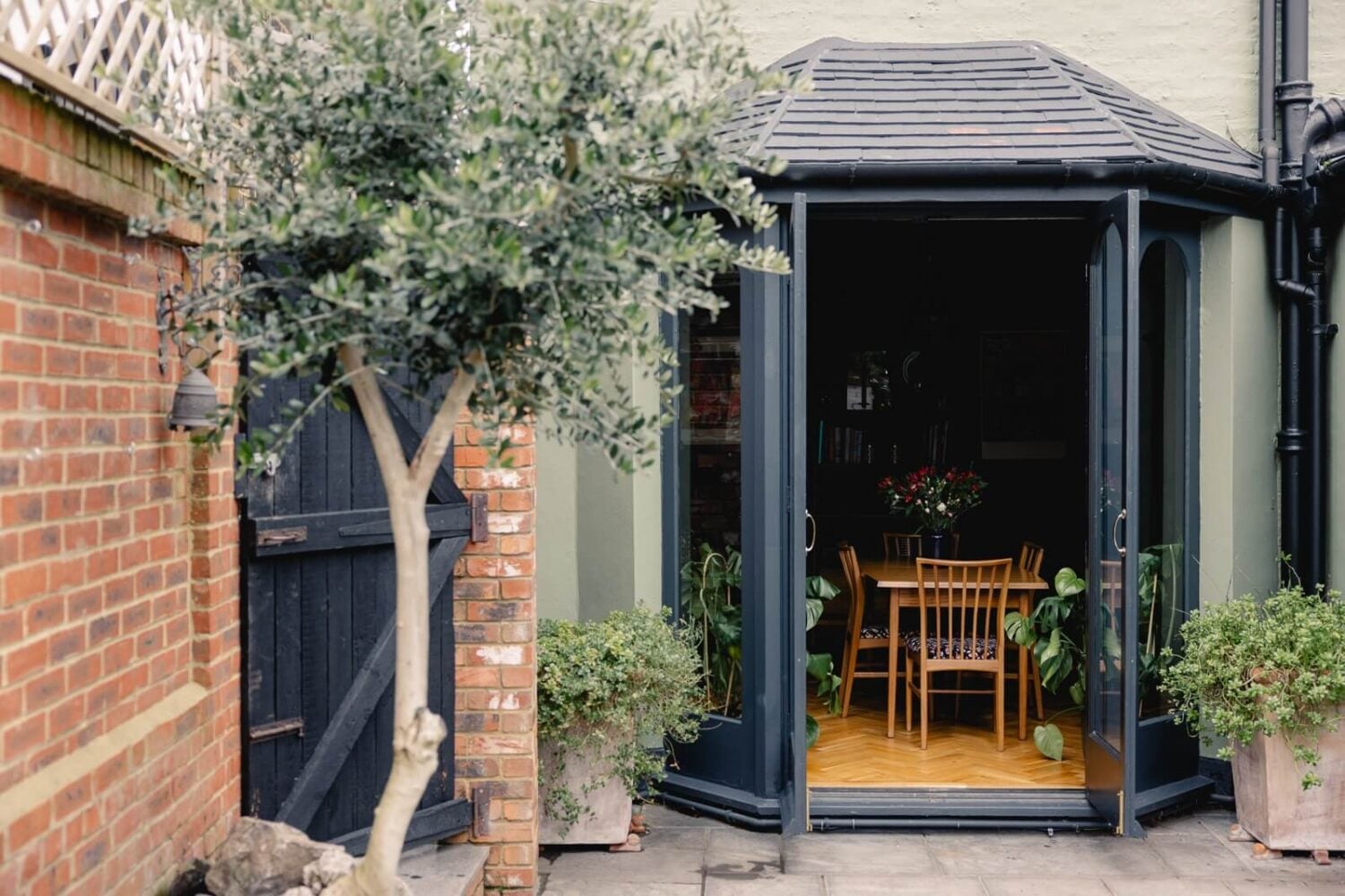 A Green Kitchen with Pink Ceiling in a Colorful London Home 10 garden-exterior-edwardian-home-london-nordroom