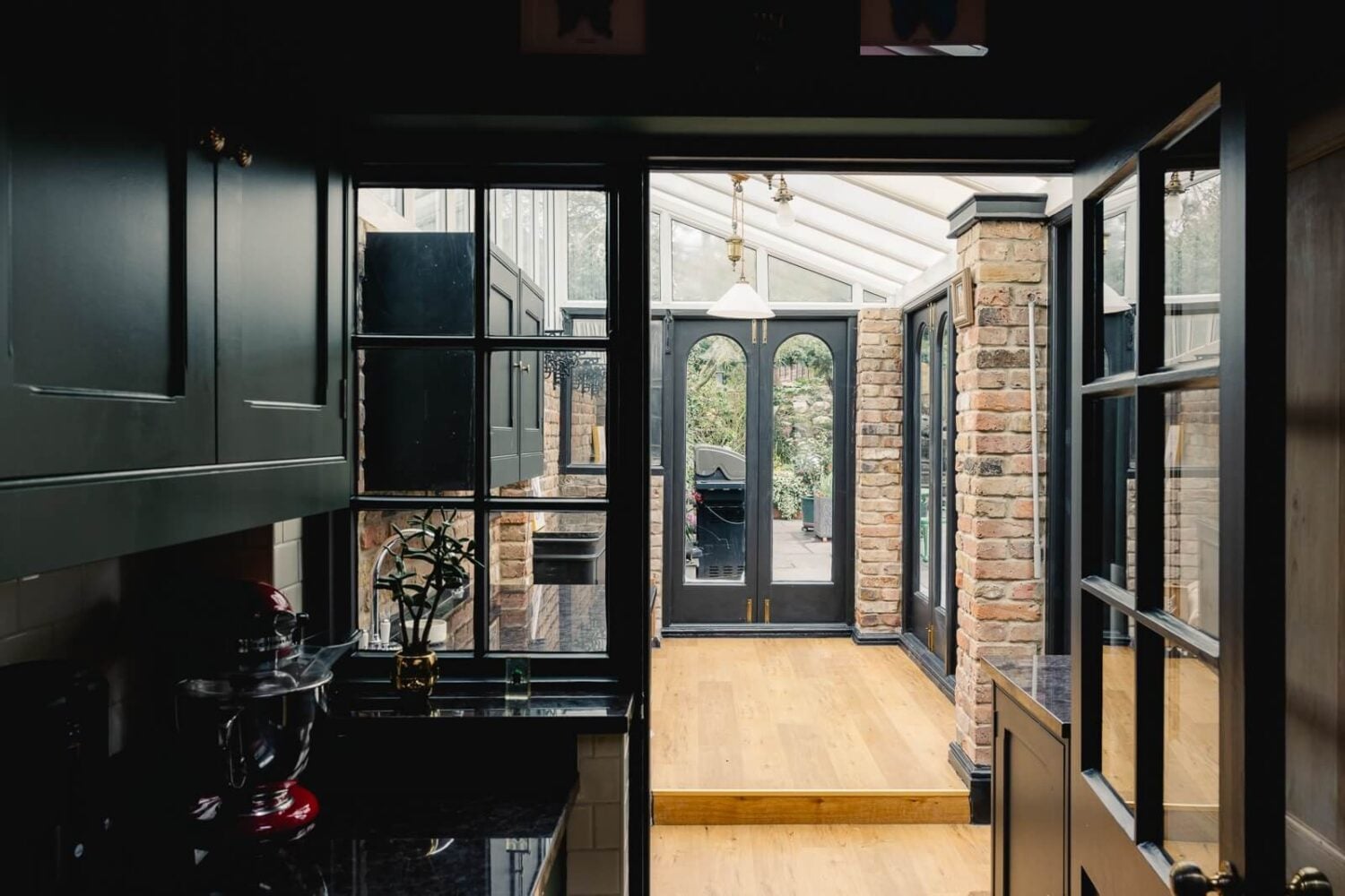 A Green Kitchen with Pink Ceiling in a Colorful London Home 26 hallway-exposed-brick-edwardian-home-england-nordroom