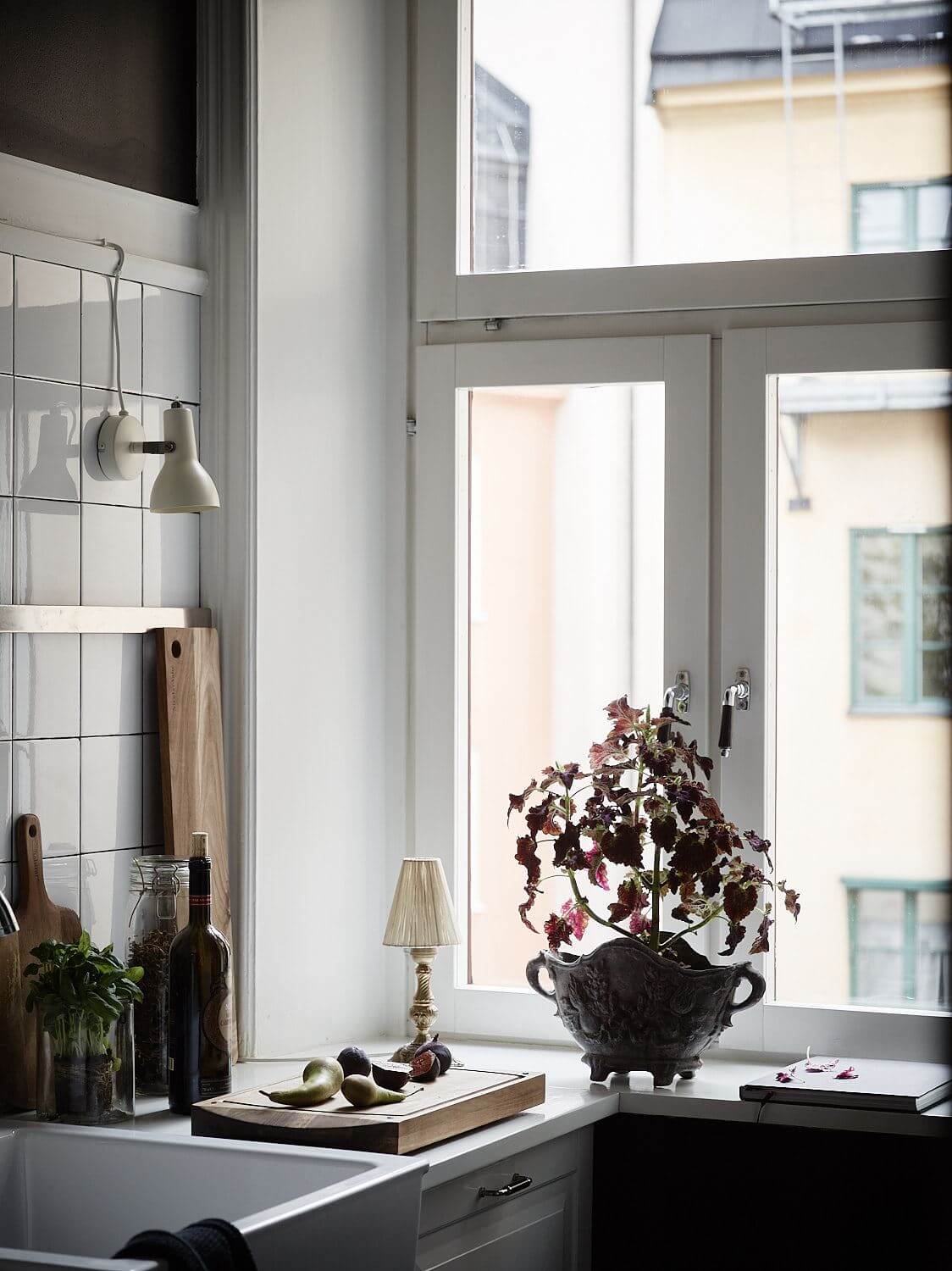 A Black Vintage Studio Apartment 13 kitchen-black-walls-white-cabinets-nordroom