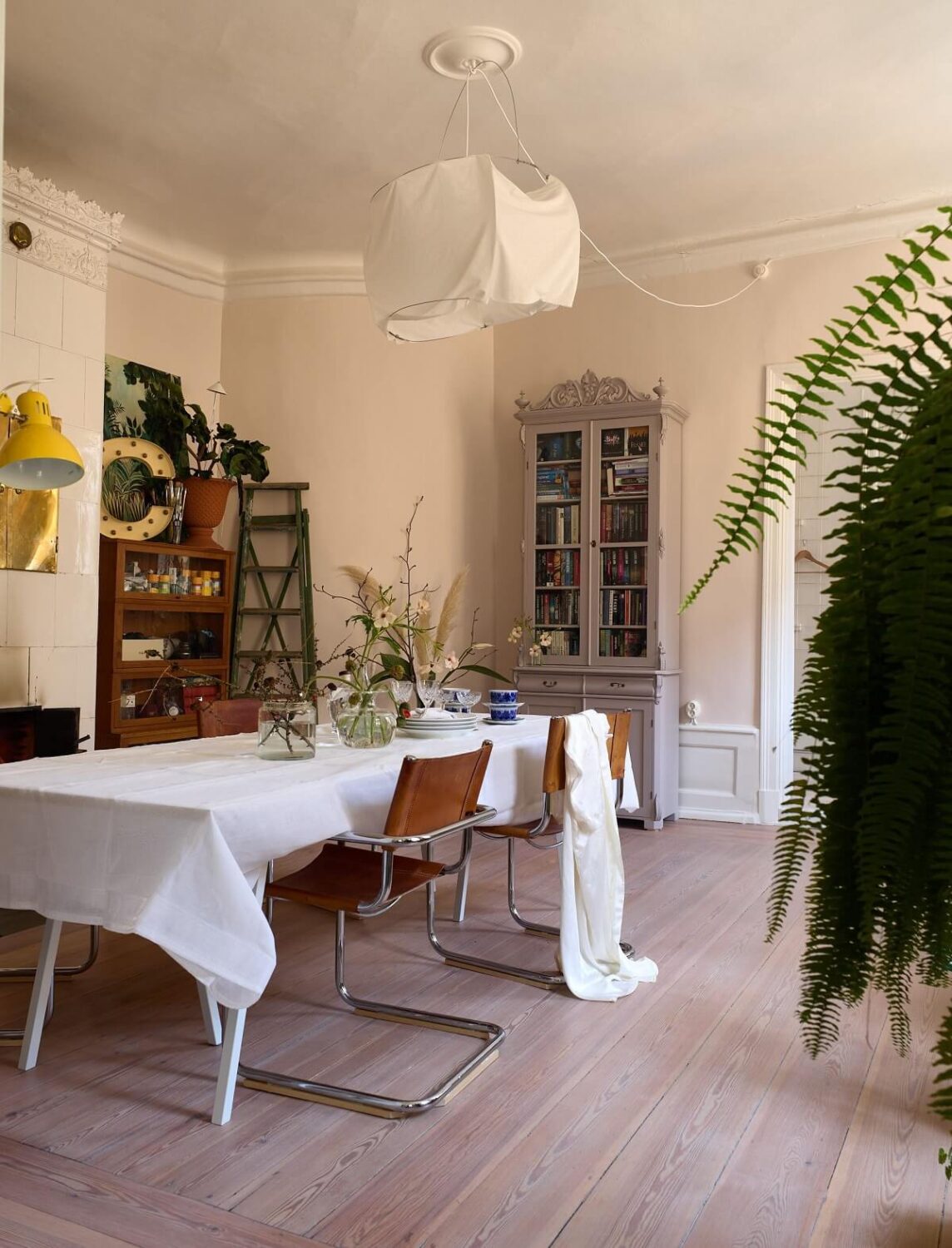 A Cozy Plant-Filled Home in Sweden 2 large-dining-room-plants-scandinavian-home-nordroom