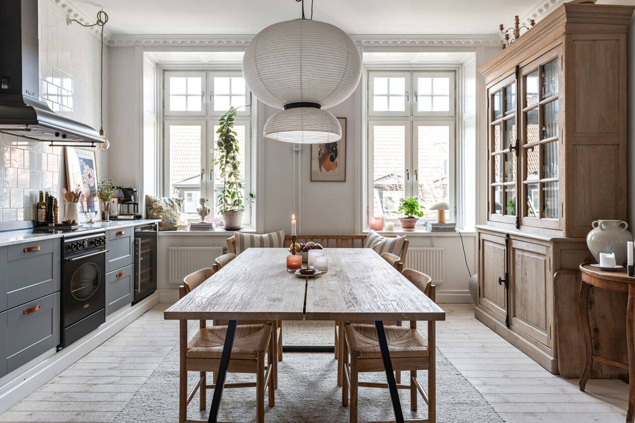 A Lovely Natural Apartment in Sweden 8 large-scandinavian-kitchen-gray-cabinets-large-wooden-dining-table-nordroom